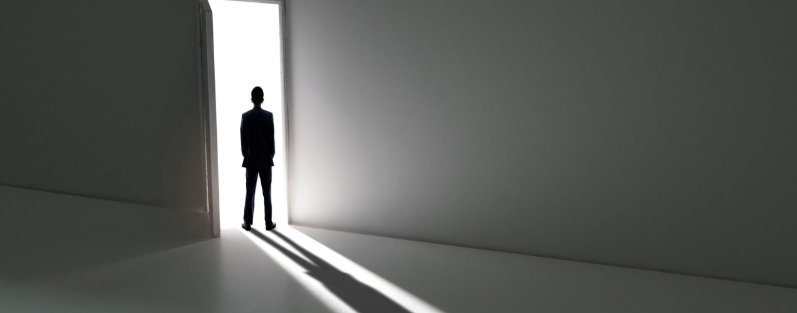 man walking out the door