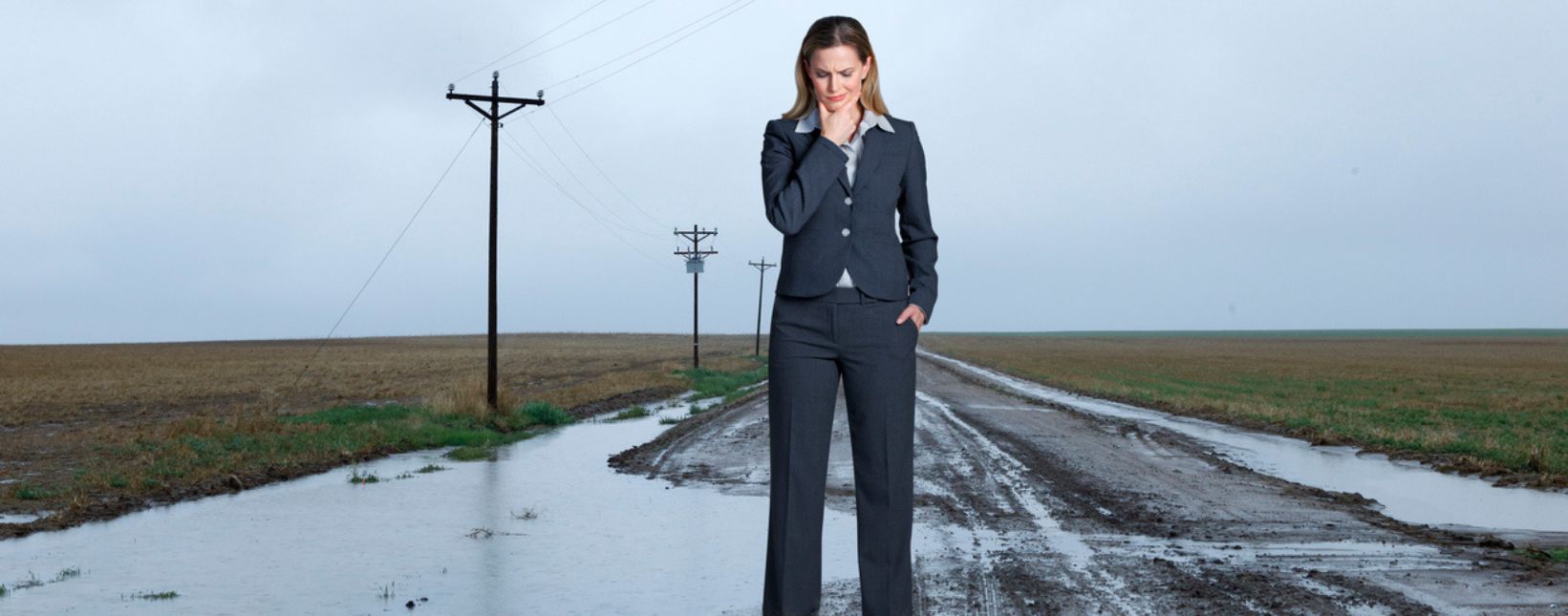 women looking on ground and thinking